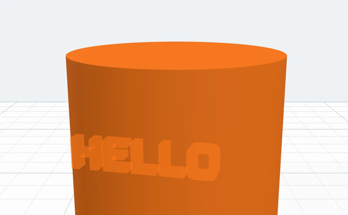 A see-through copy of HELLO following the mouse over an orange cylinder