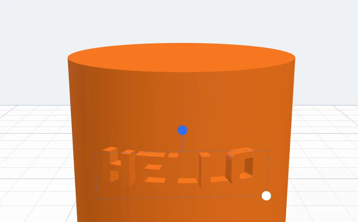 The cylinder with raised HELLO joined to it, previewed in the body's colour