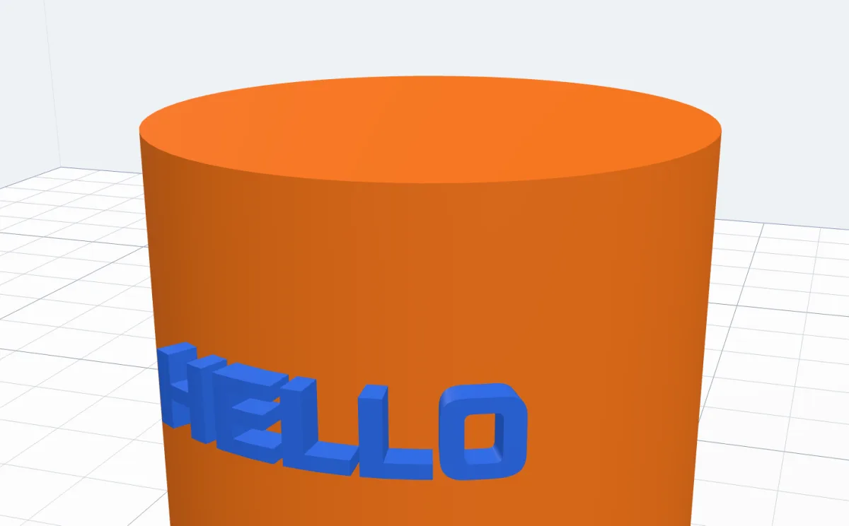 Blue HELLO placed round the orange cylinder