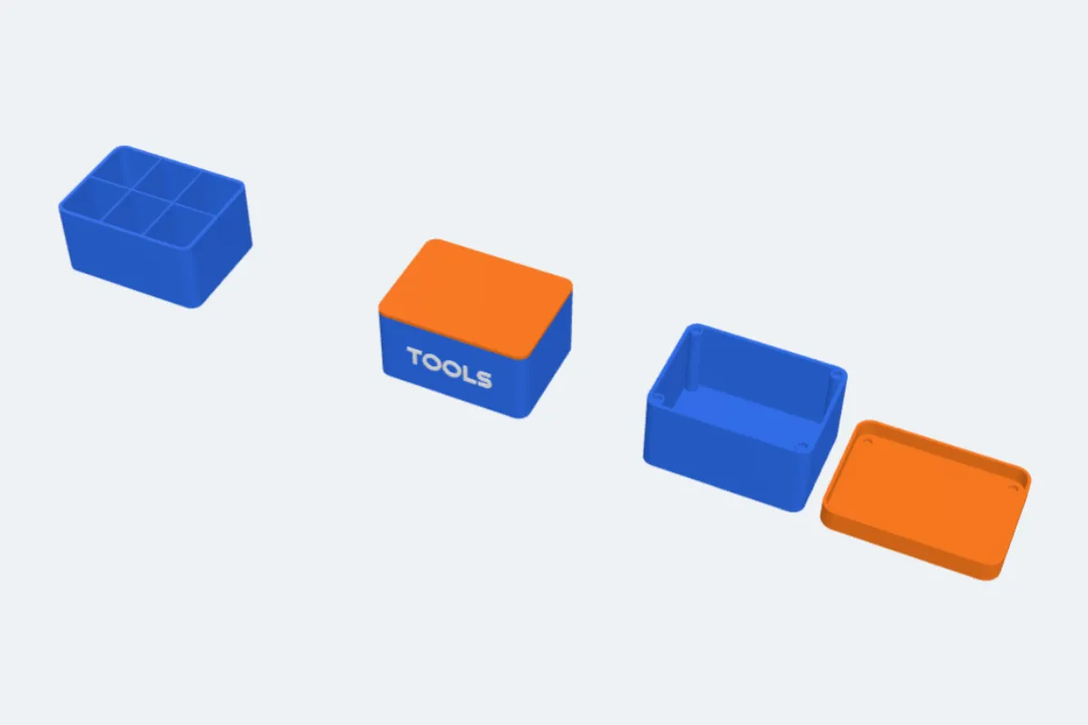 A box with six compartments, a closed box with TOOLS on the front, and a box with a cap lid and magnets
