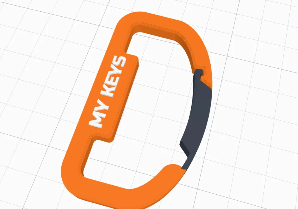 The default carabiner: an orange D-shape with MY KEYS on its spine and a dark gate on the right
