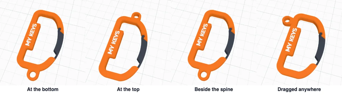 The key ring eye at the bottom, at the top, beside the spine and dragged to the top left corner