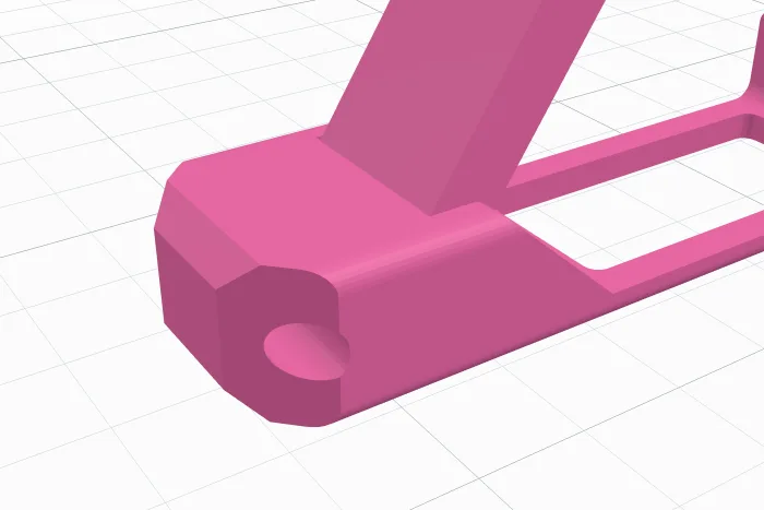 A pointed end cut at 45 degrees with the hole across its tip