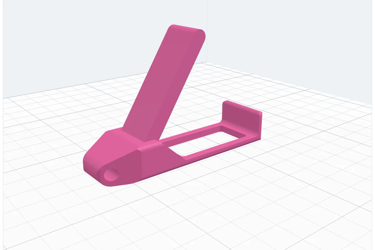 A pink folding keychain phone stand with its lever standing open, a key ring hole at the end and a window in the floor