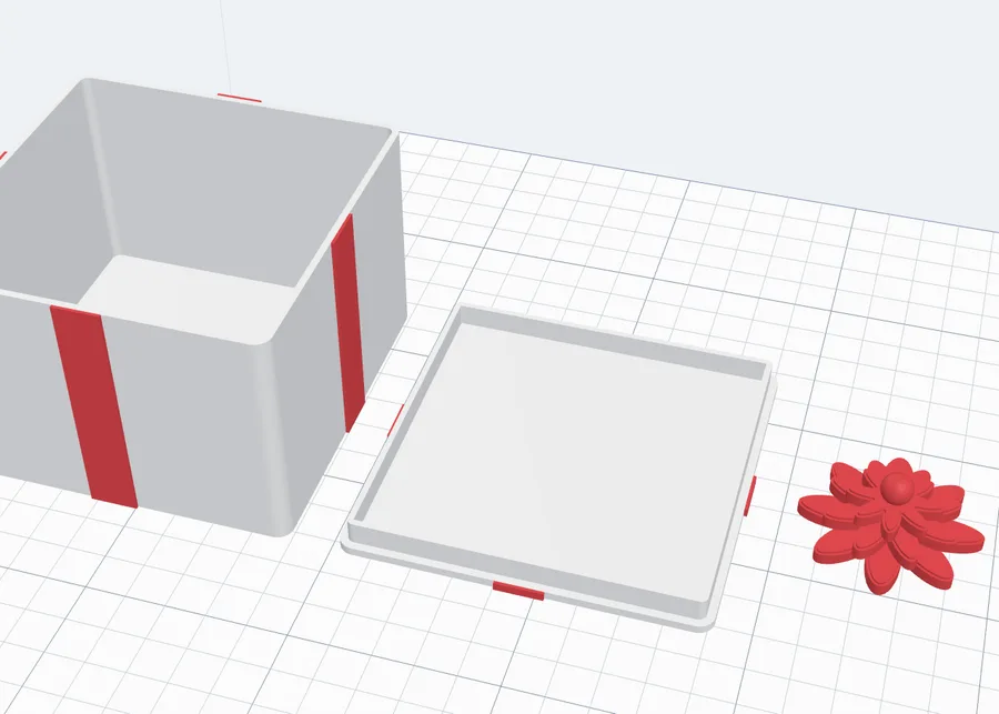 A flat lid with a lip, upside down beside the box