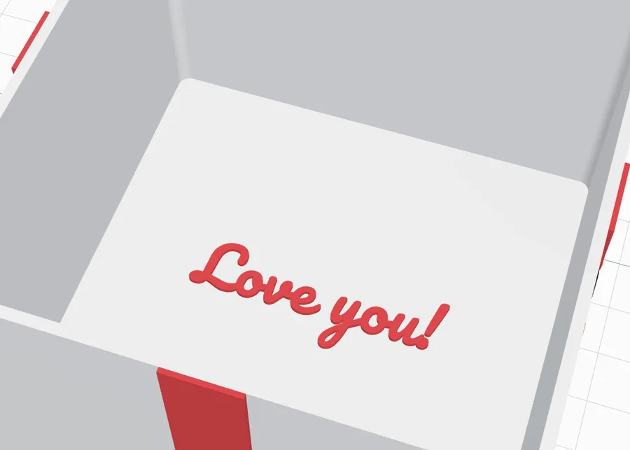 An open box with Love you! raised on its floor inside