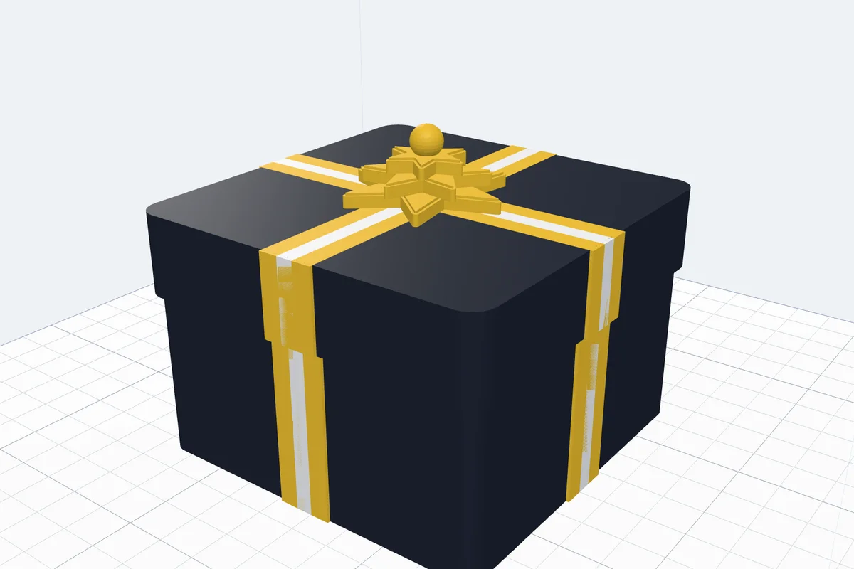 A 3D printed navy gift box with a gold ribbon with a white stripe and a gold star bow