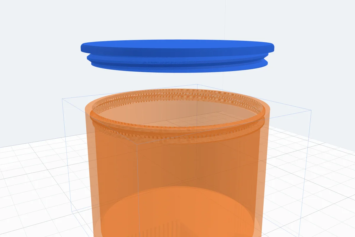 A blue threaded lid lifted above a see-through orange pot, the matching thread cut inside the pot's rim