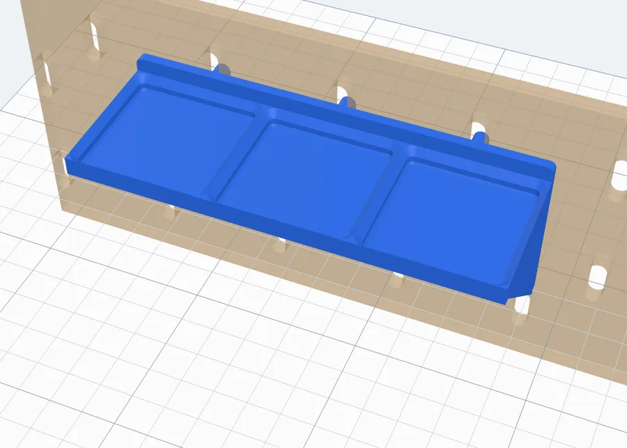 A Gridfinity shelf three units wide with three sockets