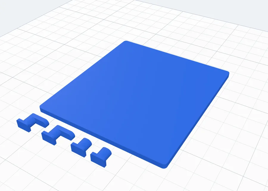 A plate lying on its back with its clips beside it