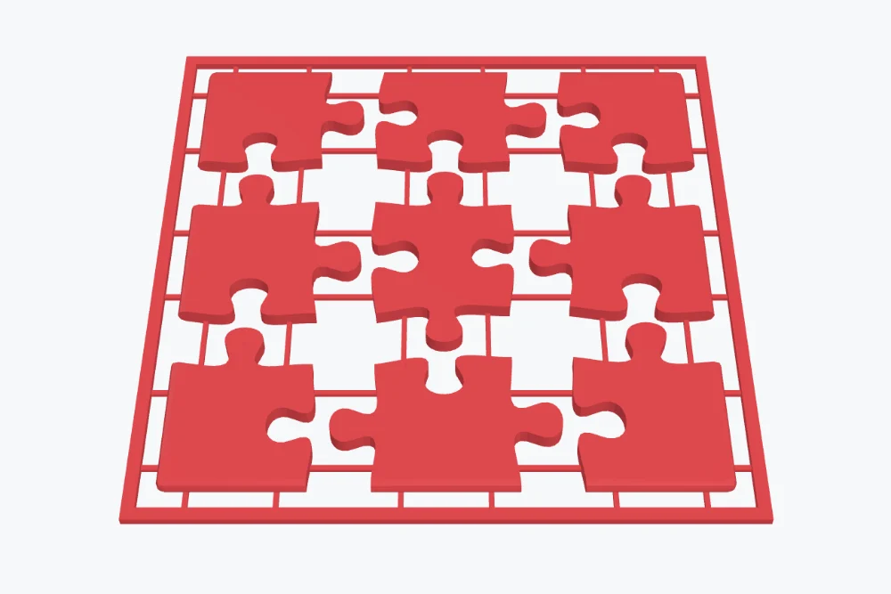 A 3 by 3 puzzle printed as one sheet: the pieces joined by thin bridges inside a border