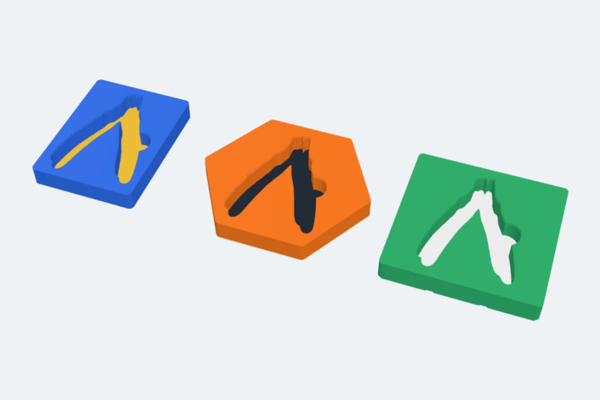 Three tool inserts with a pliers pocket: blue with a yellow floor, an orange hexagon and a green Gridfinity bin