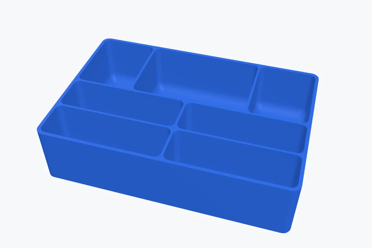 A tray with three rows of compartments, the back row deeper, with rounded inner corners and a curved floor fillet