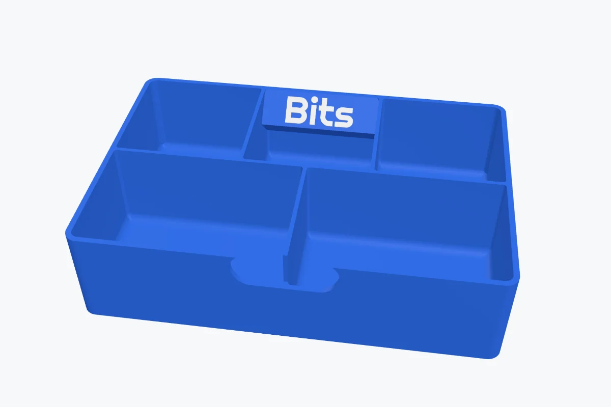 A tray with a slanted label tab inside the back wall reading Bits and a finger pull in the front wall