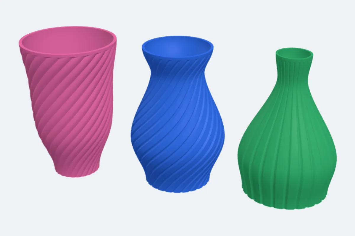 A pink tulip vase with petals, a blue classic vase with a spiral and a green bottle vase with ribs