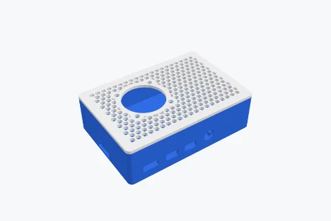 A Raspberry Pi 4 case with a honeycomb lid and a fan mount
