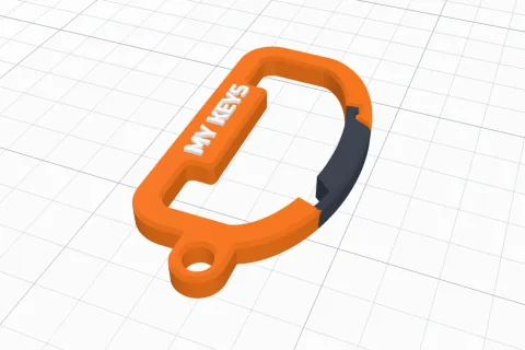 A 3D printed orange carabiner with a spring gate and a name on its spine