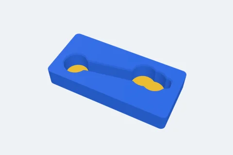 A tray with a pocket shaped like a spanner