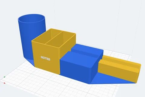 A 3D printed desk organiser: a pen cup, a bin, a phone slot and a card slot on one base