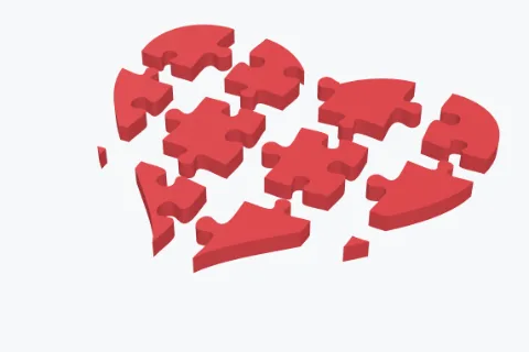 A heart cut into puzzle pieces